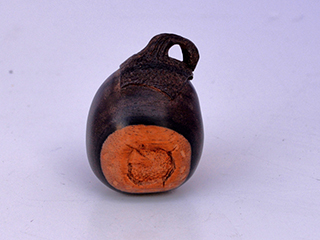 Netsuke: Round Overripe Eggplant by Don Matsumura